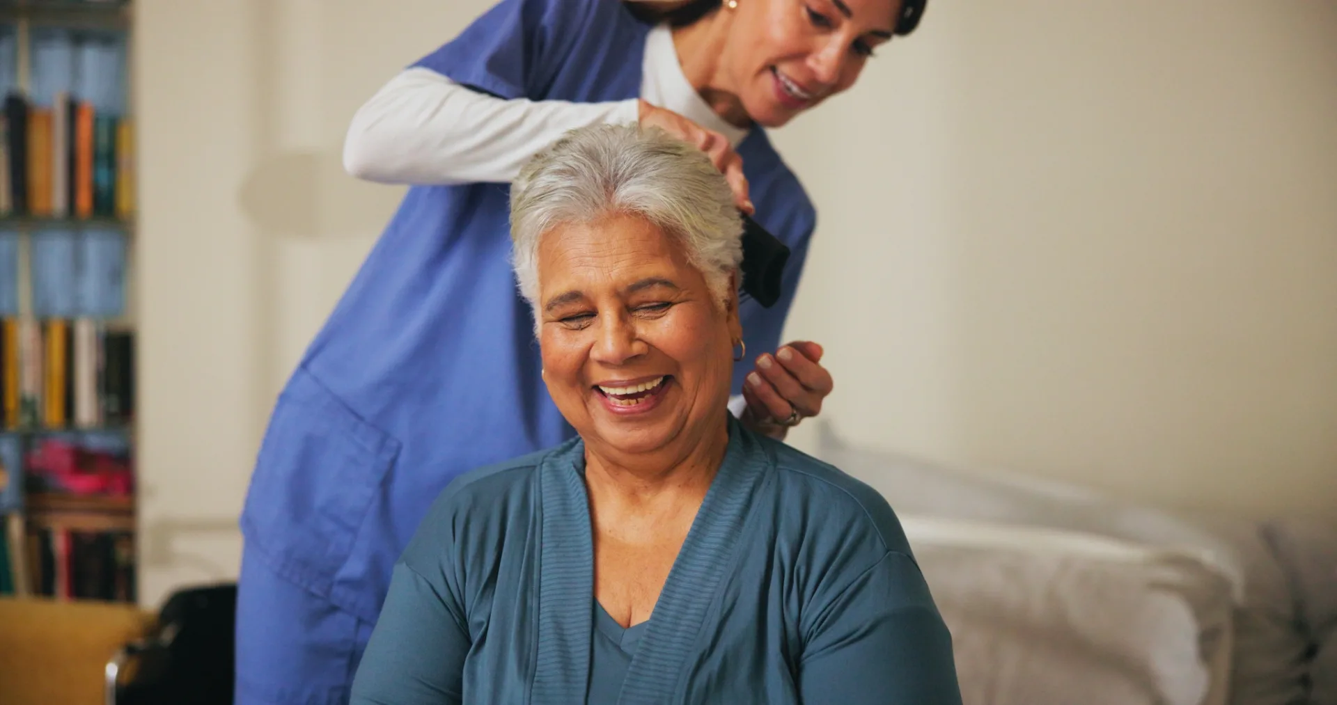 house-brushing-hair-and-senior-woman-with-nurse-2025-01-15-17-58-57-utc (Large)